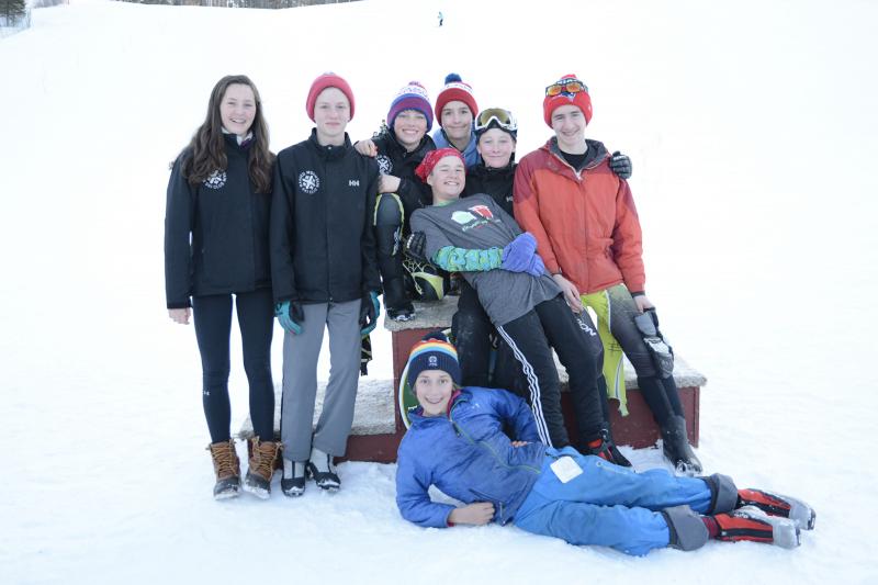 Eighth graders: L-R: Isabelle Manahan, Rhys White, Noah Lachance, Tanner Robinson, Emerson Brott (back), Devon Smith, Lake Lindelof, Oscar Horovitz (front on snow). (Courtesy Becky Lowe Photography)