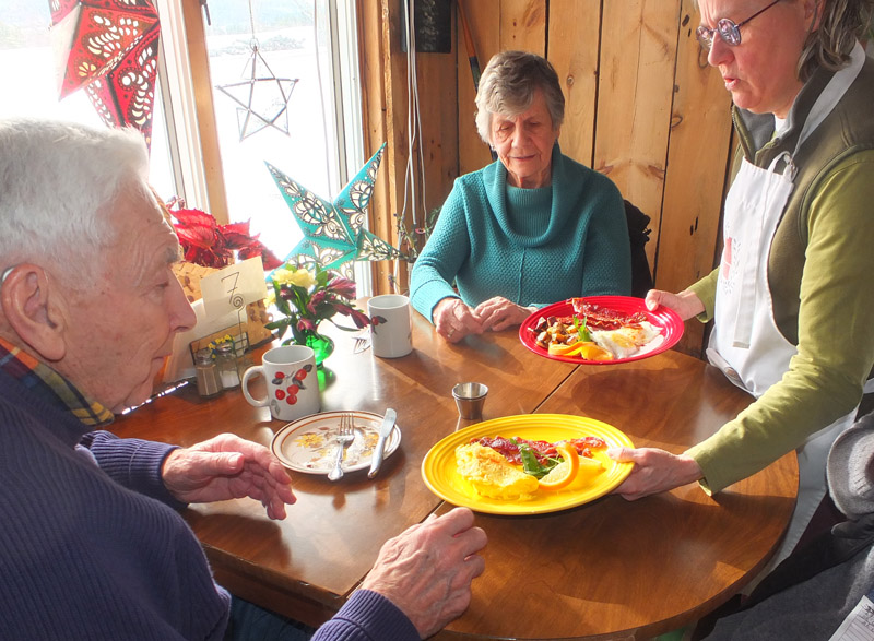 Johnson Talbot and Ann Hayes are served breakfast by Sue Ellen Mink Roberts
