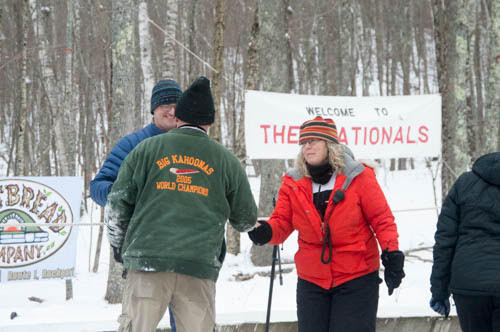 Toboggan National Committee Chairman Holly Edwards congratulates Bruce Richards of the Three Big Kahoonas team. (Photo by Marisa Hanning)