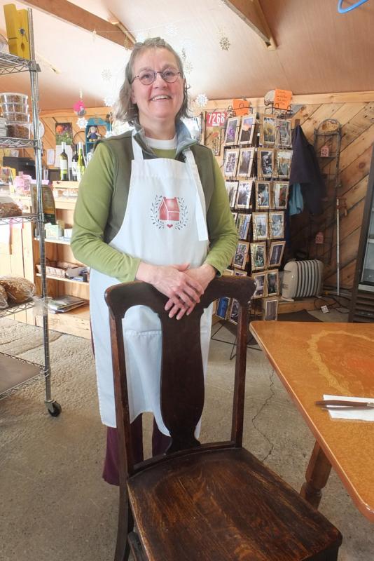 Mink-Roberts sands with one of the farm’s original chairs from 1897