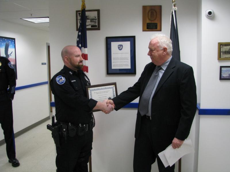 Rockland Police Chief Bruce Boucher (right) congratulates Officer Andrew Redden for being chosen as the department’s Police Officer and Employee of the Year for 2016. (Photo courtesy of the Rockland Police Department)