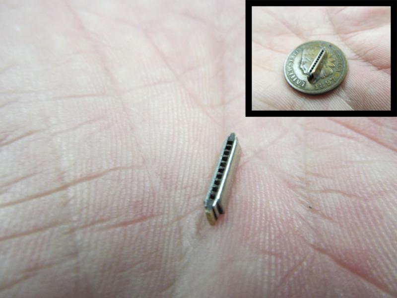 A miniature metal harmonica created by Bill Studebaker of Studebaker Miniatures. (Photo by Kay Stephens)