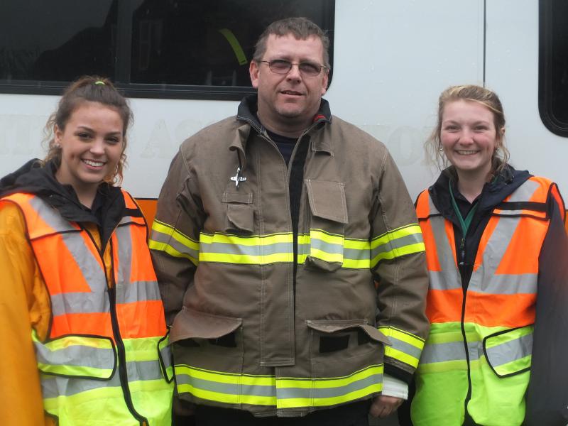 Midcoast Technology School instructor Mike Drinkwater stands with students Morgan Smith and Julia Kurr. (Photo by Sarah Thompson)