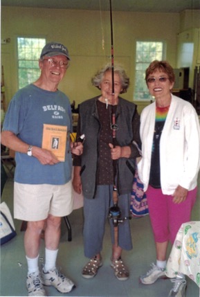 Dedicated shoppers from Bayside at last year’s Flea Market, Robert, Violet, and Joy. Violet was thrilled to find this fishing rod with mackerel rig. (Photo by Mary Schulien) flea market