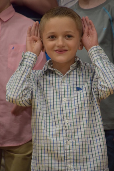 Liam DuPont performs with his third-grade class.