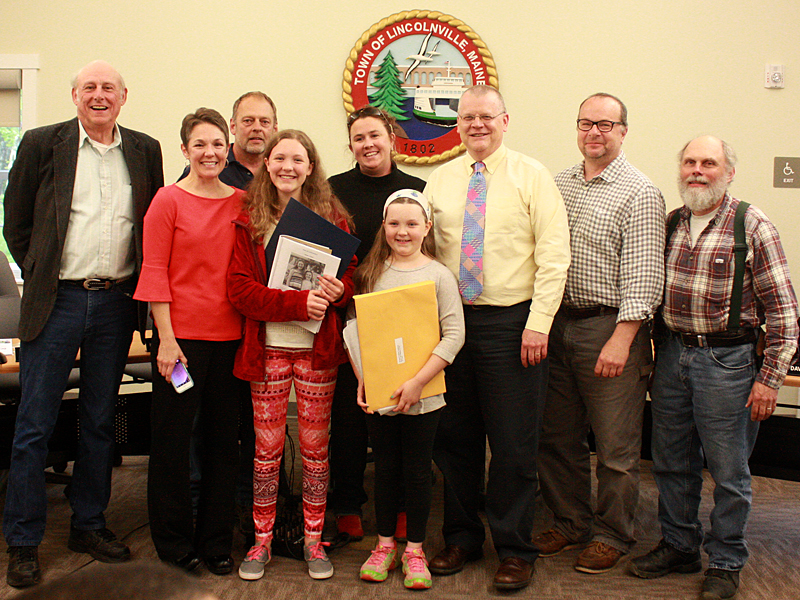 From left, Lincolnville selectman Rosey Gerry, Michelle Brown-Kinney, selectman Keryn Laite, Isabella Kinney, board chairman Ladleah Dunn, Maren Kinney, town administrator David Kinney, selectman Arthur Durity and selectman Dave Barrows.