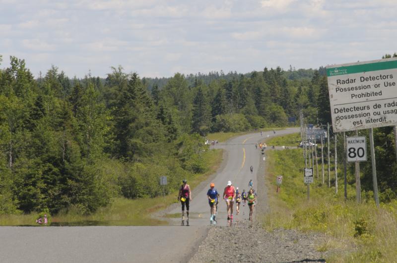Runners of the Great Bay of Fundy International Full and Half Marathons push up a hill in Campobello Island, Canada. (Photo by Lisa Dwello)
