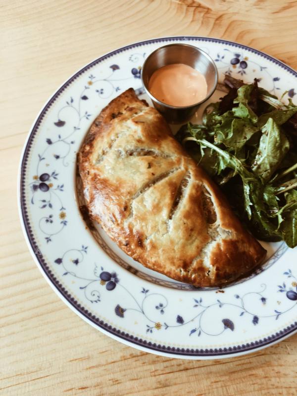 The Spaniard Hand-Pie with braised beef, red bell peppers, capers, sweet pimentos and potatoes with a red bell pepper aioli.