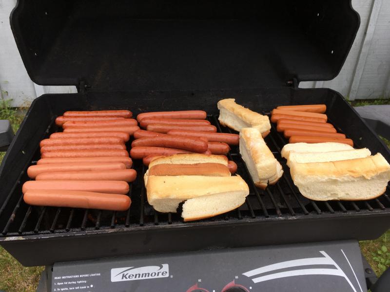 A loaded grill at Rockport Public Library’s second annual Hot Dog Day, Saturday, July 15. (Photo courtesy of Rockport Public Library.)