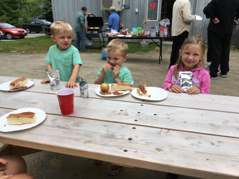 Children enjoy a summer favorite during the Rockport Public Library’s second annual Hot Dog Day, Saturday, July 15. (Photo courtesy of Rockport Public Library.)