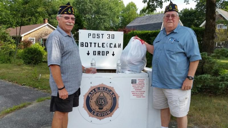 John Hyssong (left), Legion member and Cecil Dennison, Legion Service Officer, empty the post’s recycling bin of donations from community members at the Legion Hall in Camden. (Photo by Sarah Shepherd)