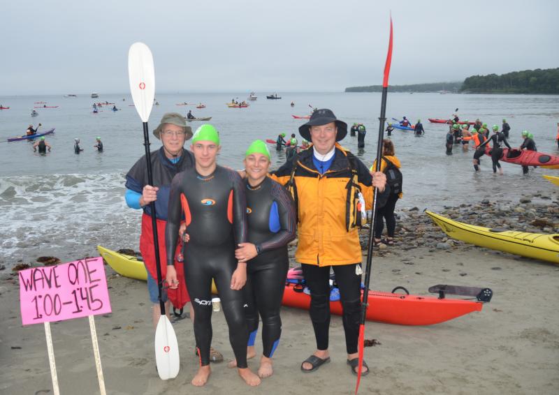 Swimmers and their paddlers take to the ocean Aug. 19 for the fifth annual Islesboro Crossing, a fundraiser for LifeFLight of Maine. (Photo by Lynda Clancy)