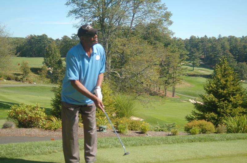 Footballer Otis Sistrunk attempts a putt. ART MAYERS/Boothbay Register