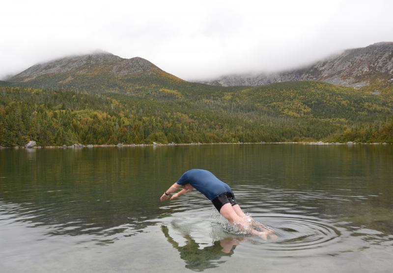 Roy Curtis dives into Great Basin Pond, which is about 51 degrees F.