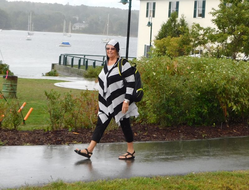 Diane Wood flees the rain. (photo by Erica Thoms)