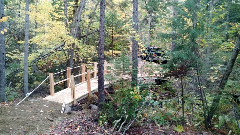 Bob White helped to build a footbridge on the Connector Trail.