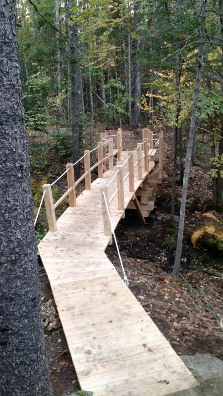 Bob White helped to build a footbridge on the Connector Trail.