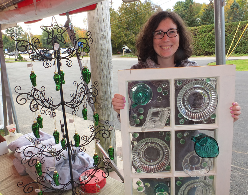 Meryl Grant held down the table for donations and the raffle for the sea glass window.