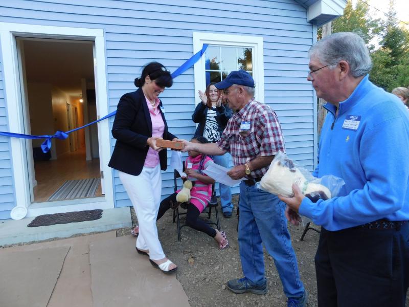 Klingelhofer presents Robbins with a symbolic brick. (photo by Erica Thoms)