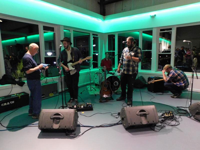 The band, Chris Ross and the North, prepares to play. (photo by Erica Thoms)