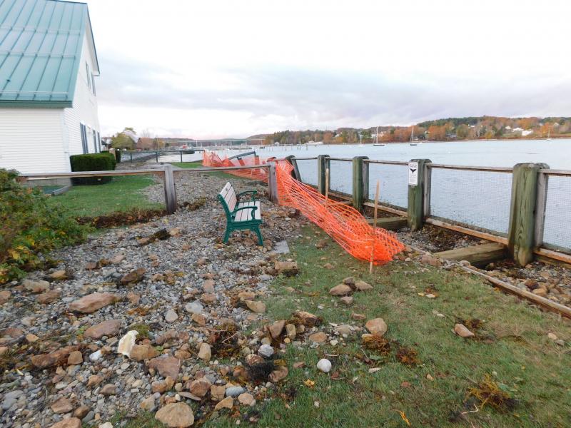 The same wall is left heavily damaged later the same evening. (photo by Erica Thoms)