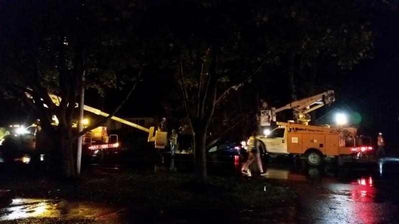 Two trucks from Central Maine Power are working on both sides of Old County Road to repair a utility pole and electrical wires that were damaged in a late afternoon crash on Nov. 6. (Photo by Sarah Shepherd)