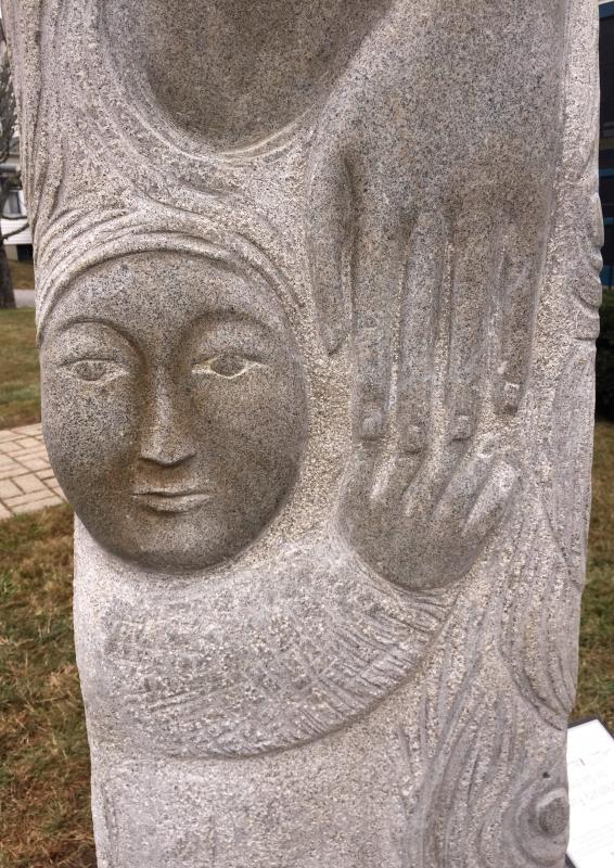 Closeup of child starting to let go of “Mother’s” hand, Lise Becu sculpture. Lise Becu