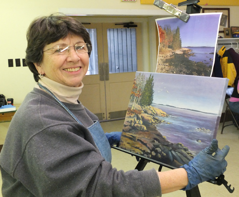 Jo M. Orise works on a still life from a photograph