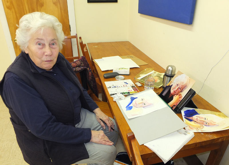 Marjorie Jones paints her niece who past away ten years ago from breast cancer from a photograph