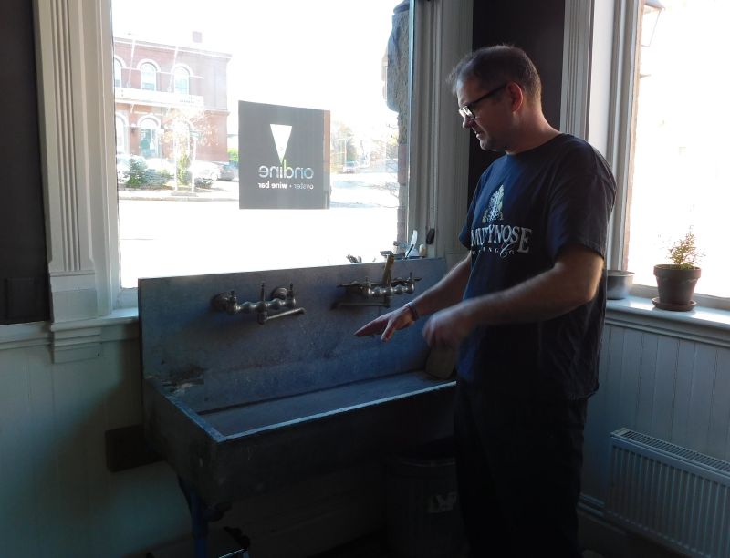 Mallett and the basin where oysters are served in the half shell, atop a pile of ice. (photo by Erica Thoms)