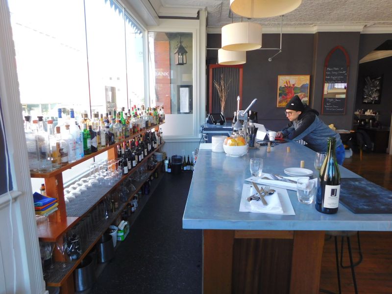 Site Manager/Coordinator Elliot Weiner stands at Ondine’s bar. (photo by Erica Thoms)