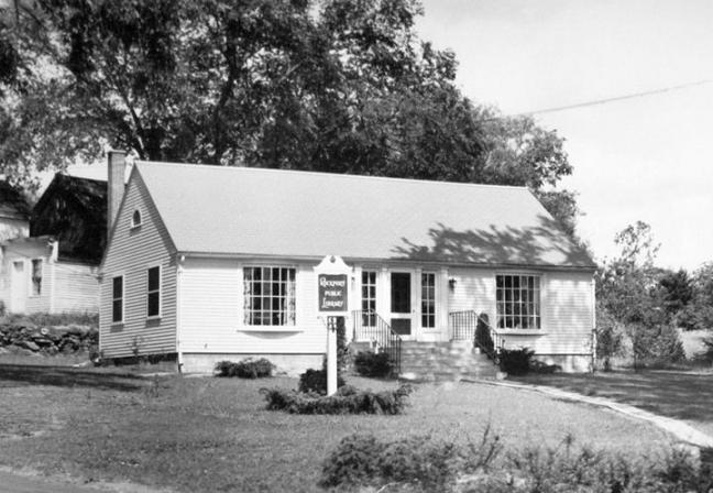 The Rockport Public Library, in its earlier days, on the the corner of Limerock Street and Russell Ave, in Rockport Village. The library site, which was deeded to the town in 1943, currently sits empty while the library collection sits in temporary quarters on Route 1, in Rockport. (Photo by Carroll Thayer Berry)
