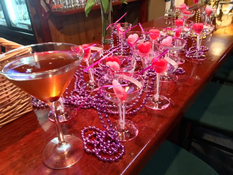 A signature manhattan with the Champagne glass name tags that Andy and Adele Bielli made for the party. SUZI THAYER/Boothbay Register