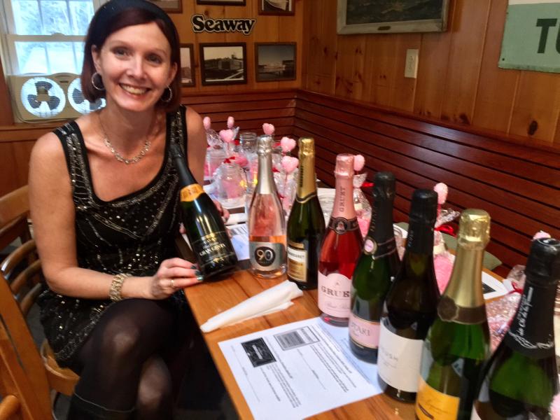 Maia Gosselin gets ready to serve up some sparkling wines at the Carriage House on Jan. 27. SUZI THAYER/Boothbay Register