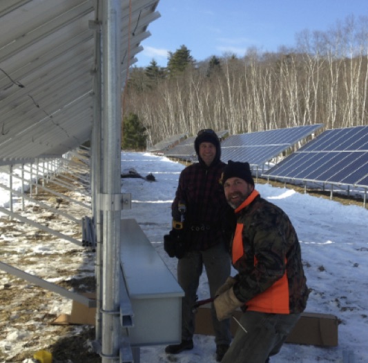 ReVision Energy’s Justin Milliken (L) and Andrew Lesko put finishing touches on Camden’s new solar array. (Photo courtesy ReVision Energy)
