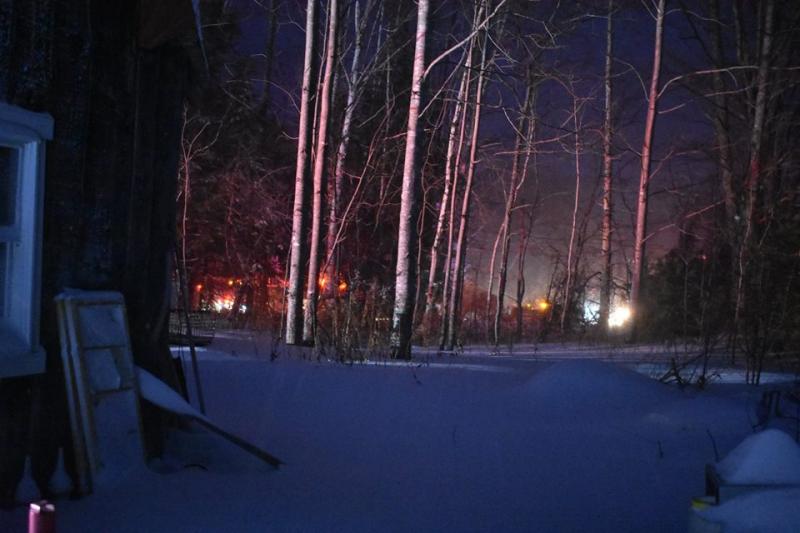 The back of the building was fully involved as seen from a neighbor’s home. (Photo courtesy of Rockport Fire Department)