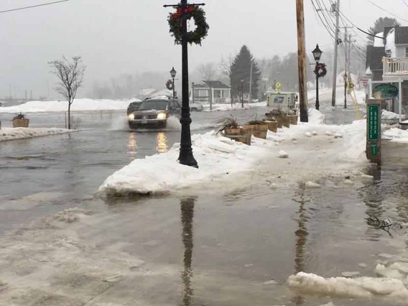 At high tide: ice floes and six inches of water flood Route One on Lincolnville Beach. (Photo courtesy The Whale’s Tooth Pub via Facebook)