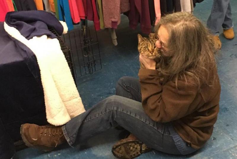 The moment Jean Stevens from New York is reunited with her cat Myla after six months of intensive search. (Photo courtesy Team Myla)