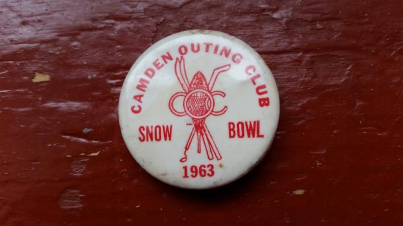 Stuart honors his father, Aubrey, by wearing his Camden Outing Club button on his ski jacket. The club sold the buttons for one dollar apiece to raise money for the mountain in 1963. (Photo by Sarah Shepherd)