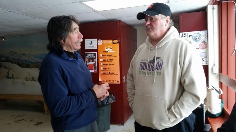 Stuart’s recovery has gotten him to the point where he can stand on both feet, although he keeps his walker nearby. Here, he is chatting with Bob Williams, one of his many supporters, at the Camden Snow Bowl.