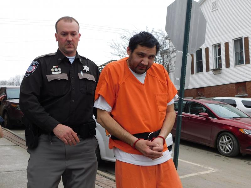 Julio Carrillo is escorted into Waldo County Superior Court. (photo by Erica Thoms)