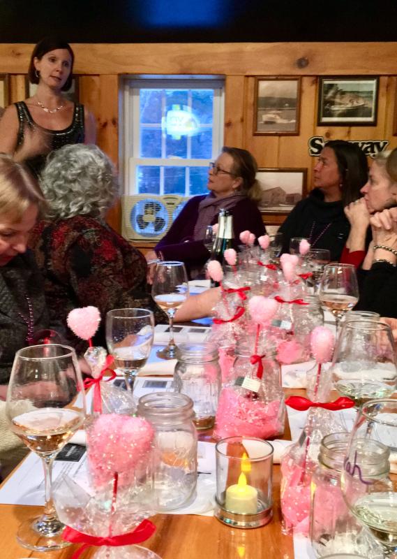 Maia Gosselin teaches a group of women from the Boothbay area about sparkling wines, at the Carriage House on Jan. 27. SUZI THAYER/Boothbay Register