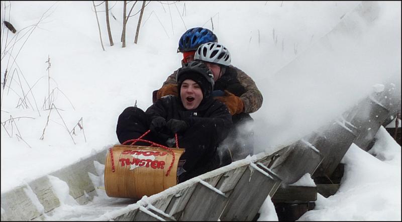 A toboggan crew takes a practice run down the chute.