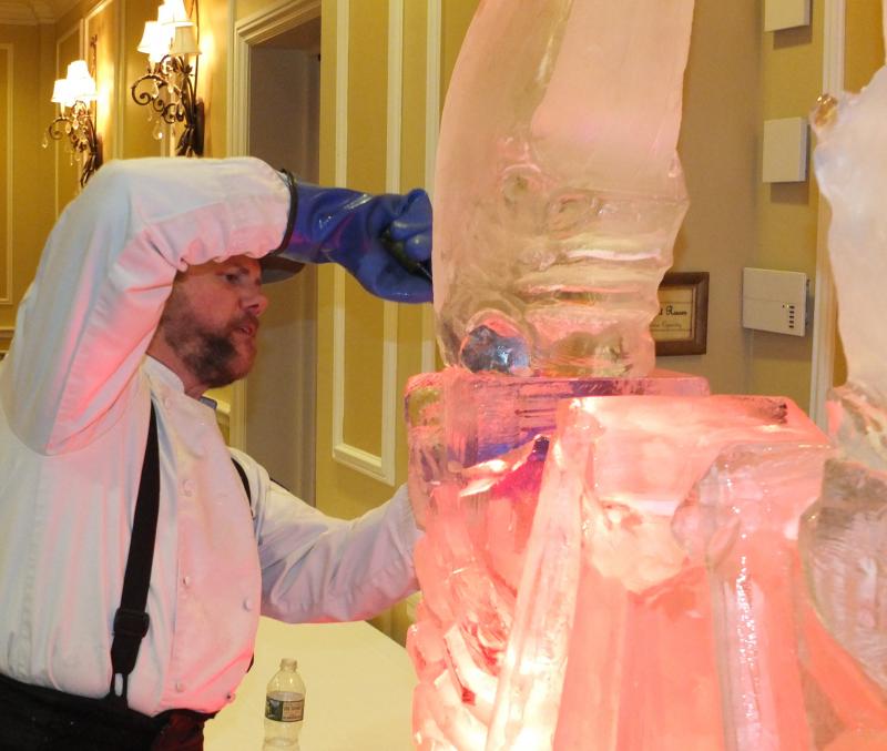 Samoset’s executive chef and master ice carver Tim Pierce adds the finishing touches to a lobster ice carving.