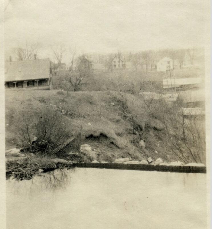 An interesting view from the top of the dam looking down into the harbor sometime before Harbor park was created. Here it is more obvious where the river would travel and how it would enter the harbor if the dam were not in place.
