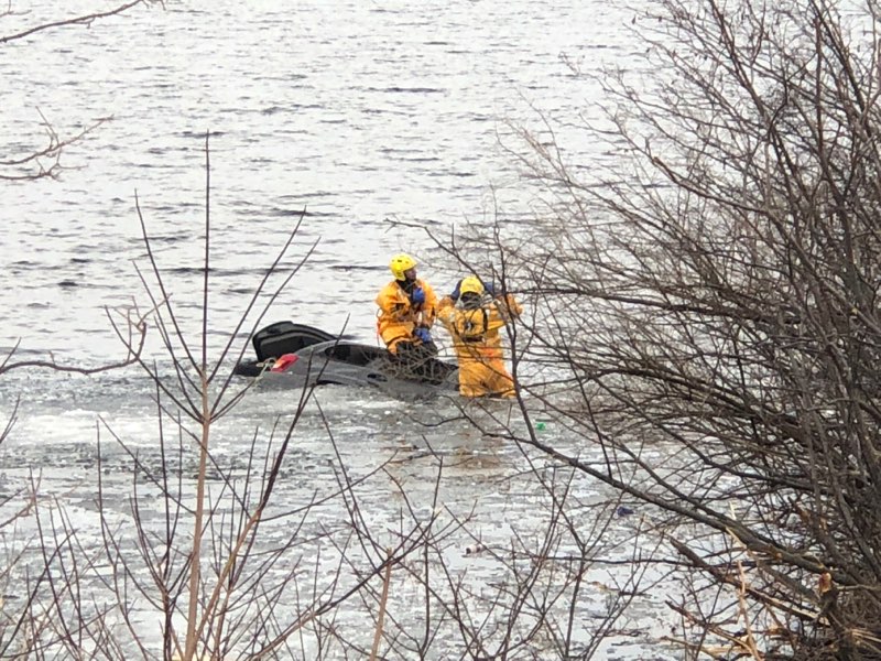 Rockport firefighters put on their cold water rescue gear this evening, March 23, to enter Chickawaukie Lake, in Rockport, to ensure no other victims were in the Jeep Grand Cherokee that landed in the water this evening, after leaving the Route 17 highway. (Photo courtesy Rockport Fire Department)