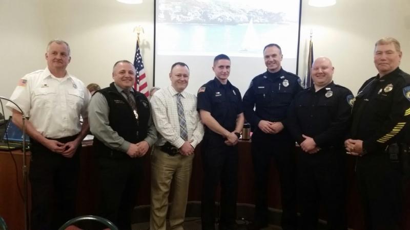 Camden Fire Chief Chris Farley, Police Chief Randy Gagne, Detective Curt Andrick, Firefighter Isaiah Backiel, Officer Chris Hansen, recently hired Officer Paul Thompson and Sgt. Dan Brown gathered after the presentations of their life saving awards and commendations at the Camden Select Board meeting March 5. (Photo by Sarah Shepherd)