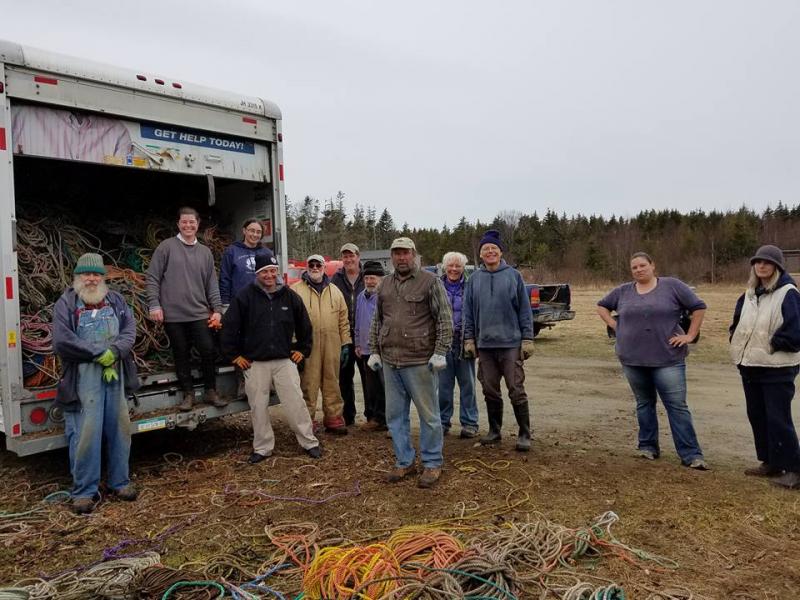 Some of the 15 or so who loaded the rope on Matinicus, from left to right: Paul Murray, Samantha Ames, me (standing up on truck bumper,) Gus Lookner (in front of me,) Joe Bray, Gary Peabody, Stan, Clayton Philbrook, Sue Liebling, Larry Liebling, Samantha Philbrook, Laura Livingston (Photo courtesy Kim Peabody)
