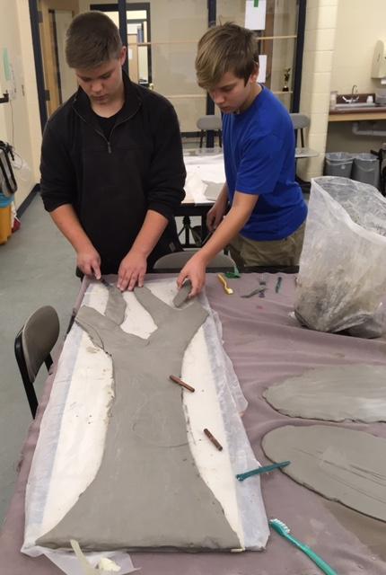 Eighth grade students create a caly relief tree; Grady Brown and Dylan Morganstern. (Photo courtesy Randy Fein)