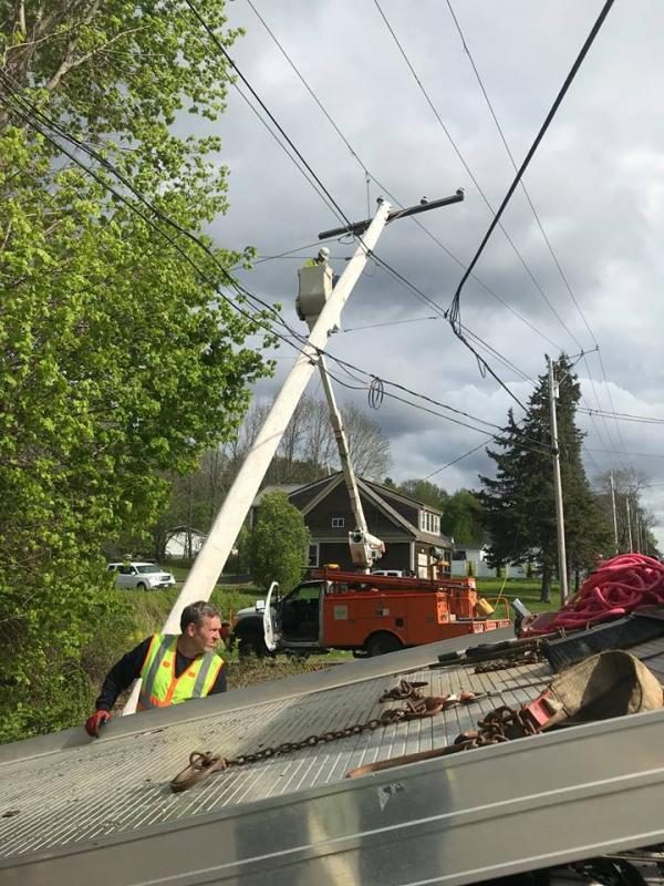 Steve Laite of Camden Exxon tows away the vehicle from the accident scene on Route 1 in Rockport. (Photo courtesy of Rockport Fire Department)